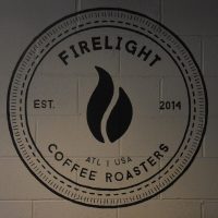 The Firelight Coffee Roasters logo from the back wall of the coffee shop/roastery in Strongbox West, Atlanta.