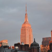The Empire State Building seen from the Highline, rising above the Chelsea skyline and bathed in the evening sun in February 2016.
