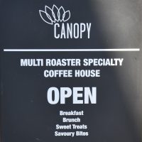 A sight for sore eyes: the A-board proclaiming that Canopy Coffee is now open after almost three months of enforced closure during the COVID-19 pandemic.