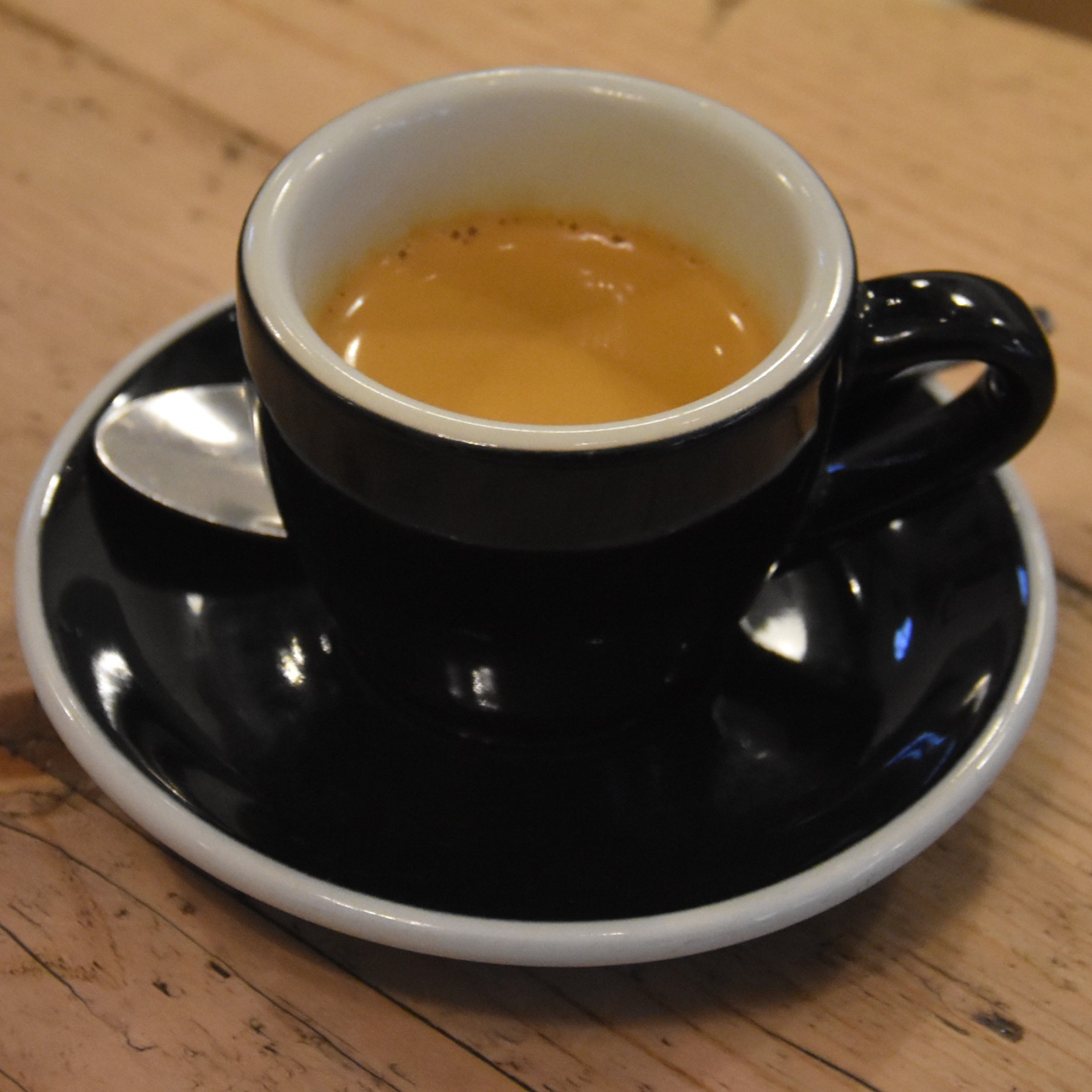 My espresso, served in a classic black cup, at Attendant Clerkenwell, made with the Brazilian Esmeralda house espresso.