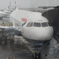 My British Airways Airbus A321neo on the stand at Reykjavik's Keflavik airport on a grey, rainy day in July.
