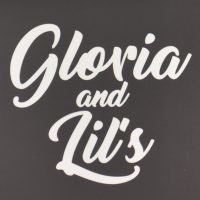 Gloria and Lil's, written in an elaborate cursive script, taken from the sign above the café.