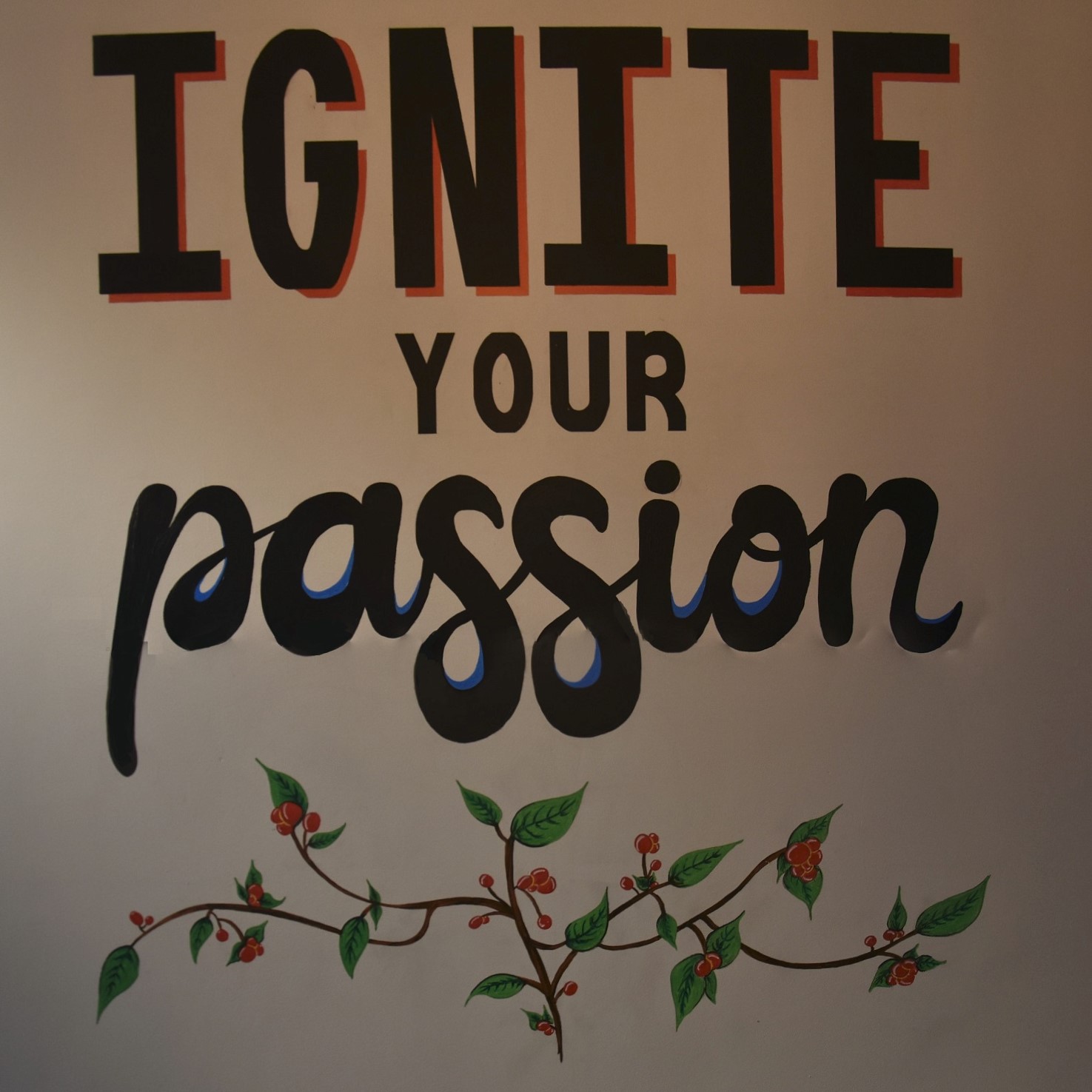 Ignite your passion: detail from the wall in the back corner of Java Roastery in Moseley.