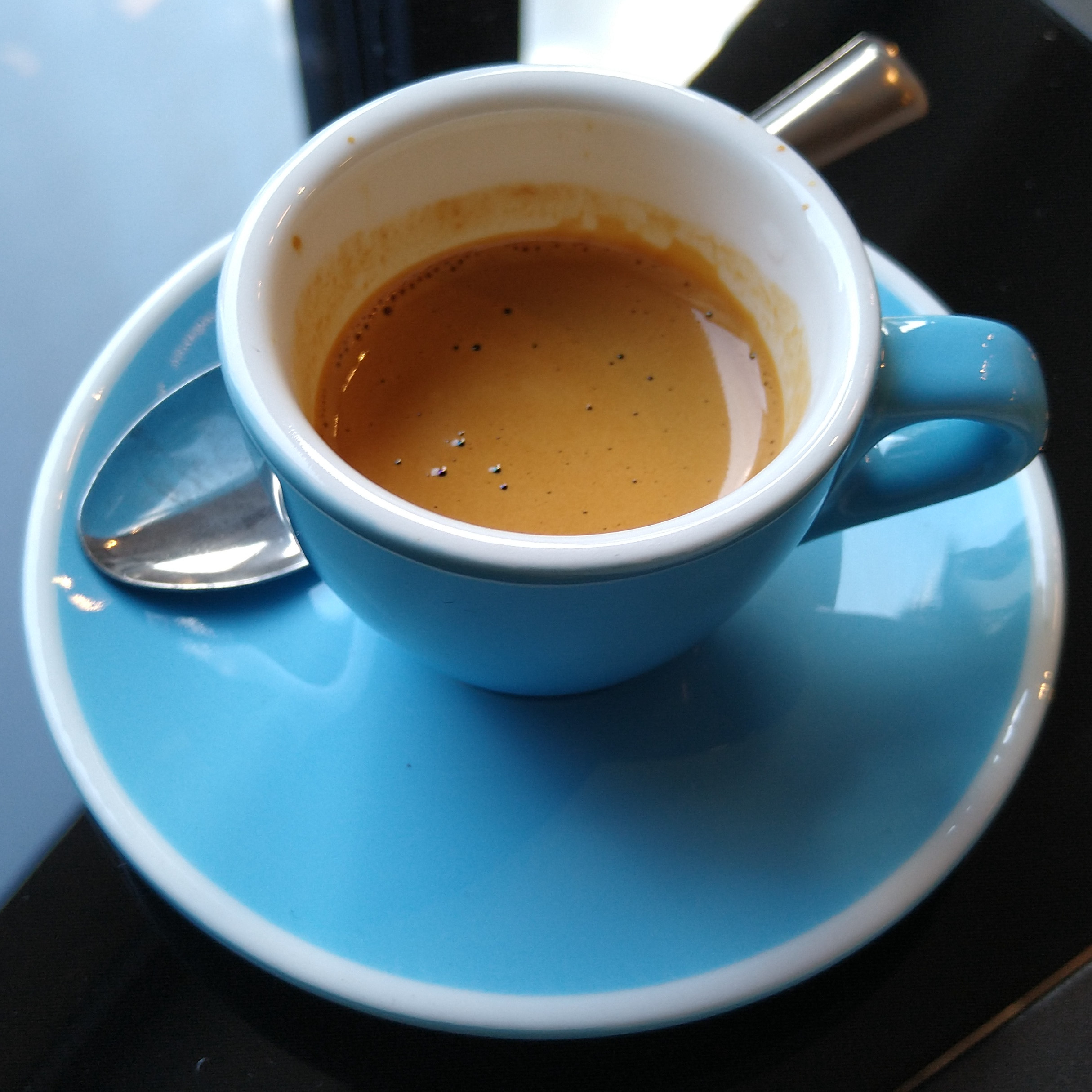 An espresso, made with Kiss the Hippo’s Bensa from Ethiopia, an anaerobic natural with tasting notes of blackberry, pineapple and strawberry jam, served at Nostos in a classic blue cup.