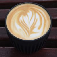 A lovely flat white with an abstract latte art pattern in it, made with the Over Under house blend and served in my HuskeeCup at Over Under Coffee, Wandsworth Town.