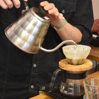A V60 pour-over being made using a gooseneck kettle at MyCloud Coffee.