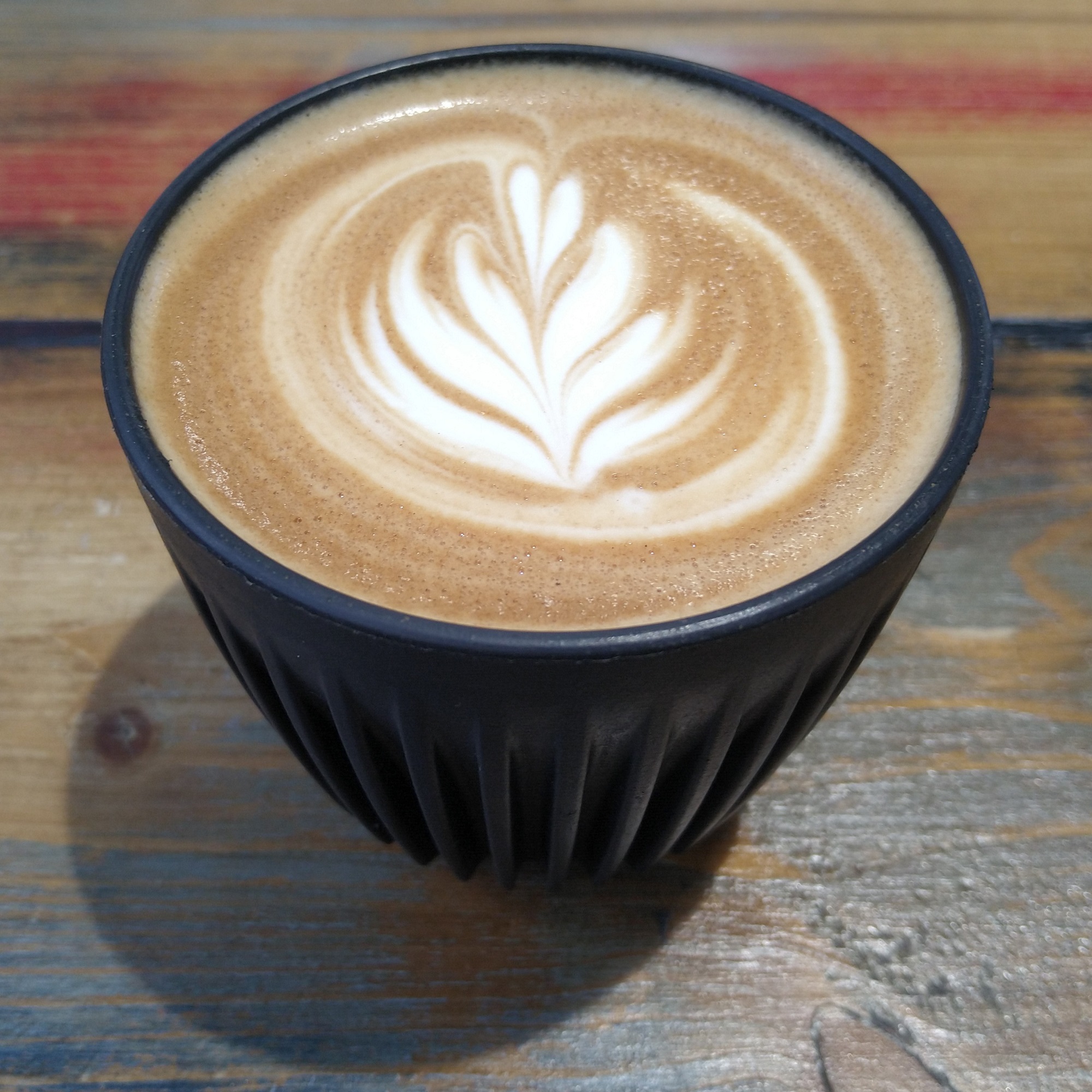 A lovely flat white, made with the bespoke house blend at Mini Beans Coffee and served in my HuskeeCup.