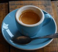 An espresso, made with a naturally-processed Ethiopia Sidamo, and served in a classic blue cup at Frontside Coffee Roasters.