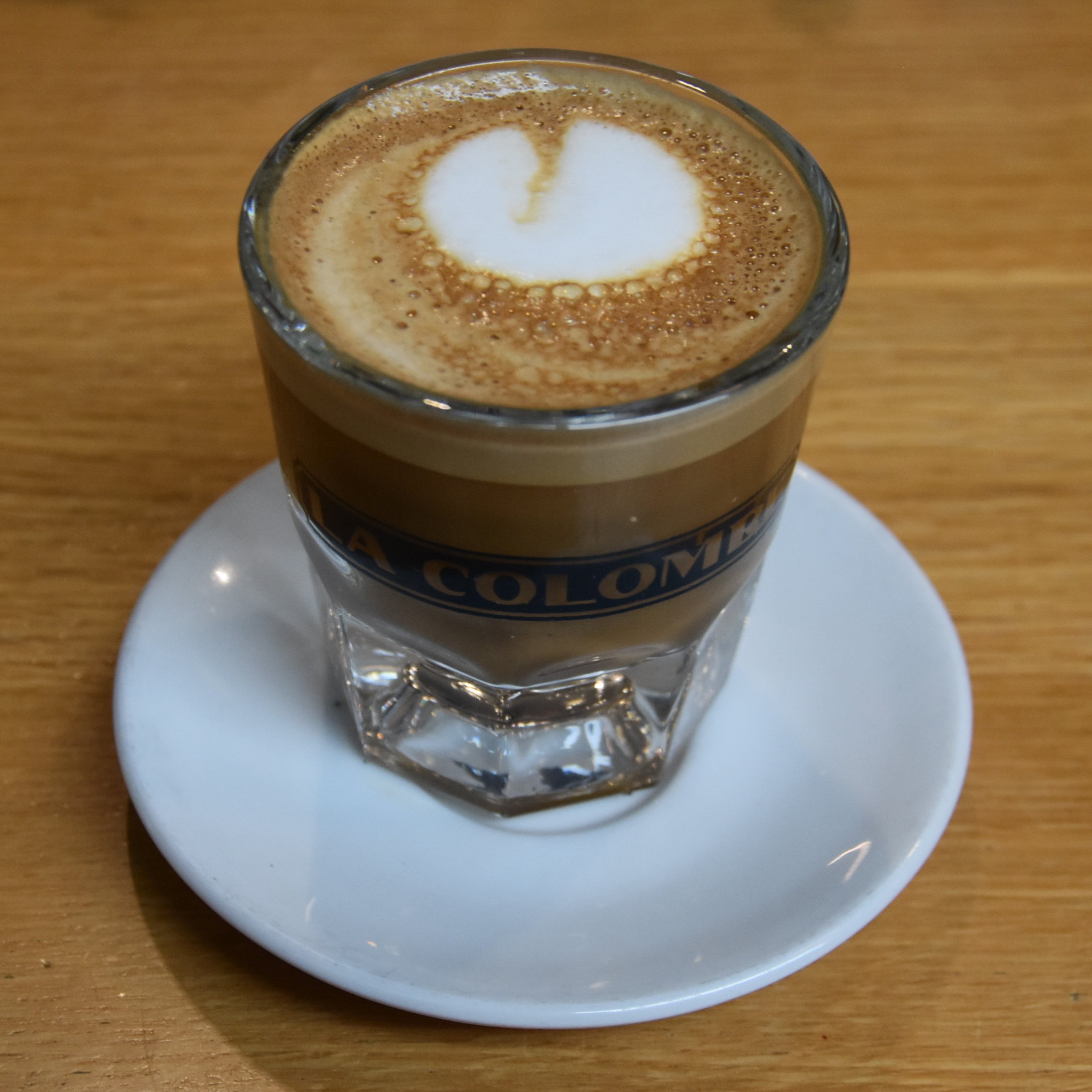 A cortado, made with the Sun Peak, a Guatemalan single-origin, and served in a glass at La Colombe, South Station in Boston.