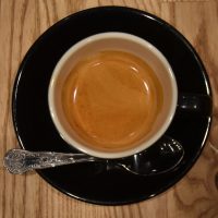 An espresso, made with the guest coffee, the Los Ancestros, a washed coffee with an extended fermentation stage from Guatemala and roasted by 39 Steps Coffee, served in a classic black cup at Tintico on Greek Street.