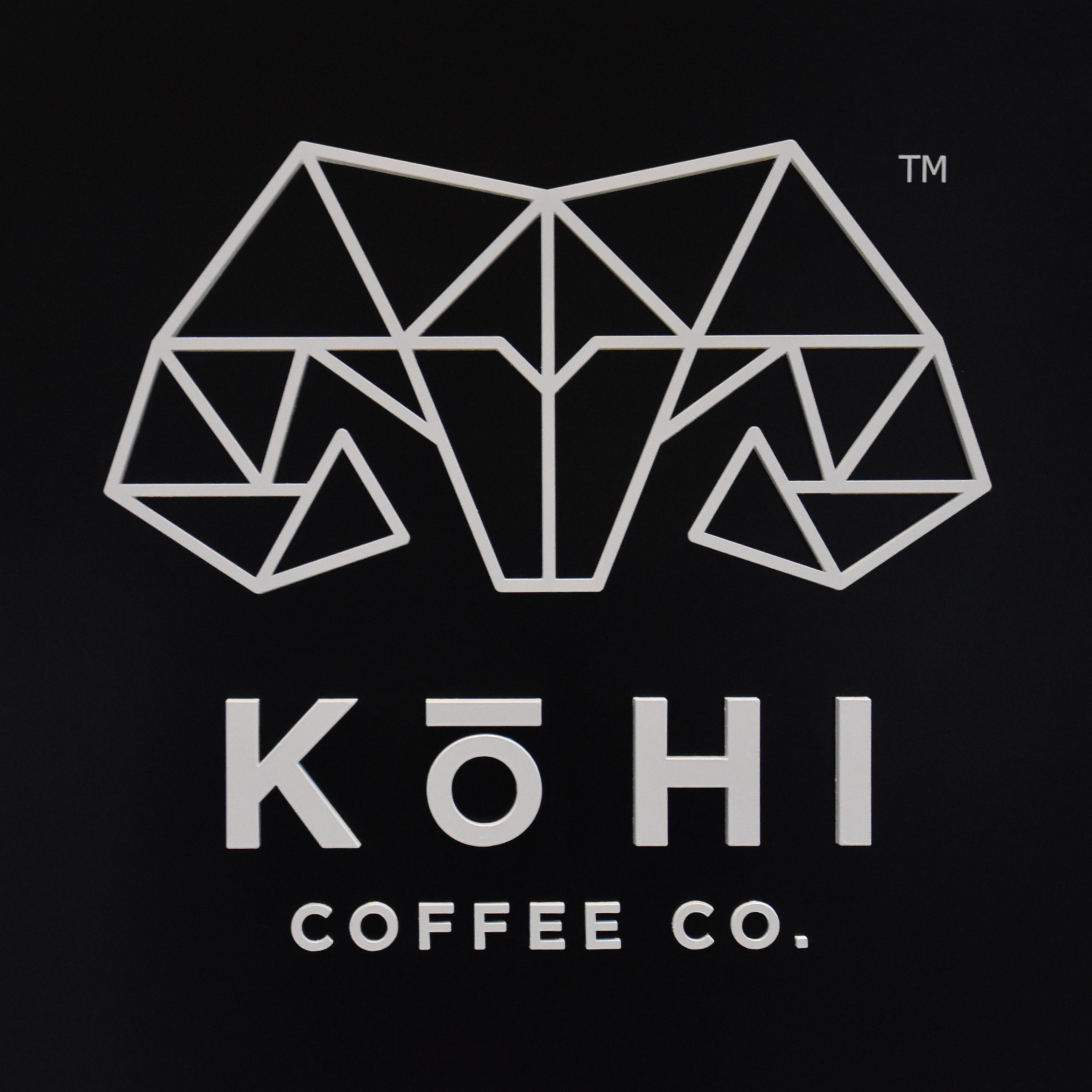 The Kōhi Coffee Co. logo from outside its Boston store inside 125 Summer Street.