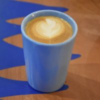 My flat white, made with the house blend at Koja Coffee, in my blue Therma Cup.