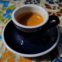 A lovely espresso, served in a classic black cup at Niedlov's Cafe & Bakery and made with the Monarch, from Onyx Coffee Lab.