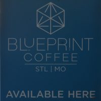 Details from the door of Blueprint Coffee, which has the Blueprint Coffee logo with the words "Blueprint Coffee STL | MO" and "Available Here" underneath.