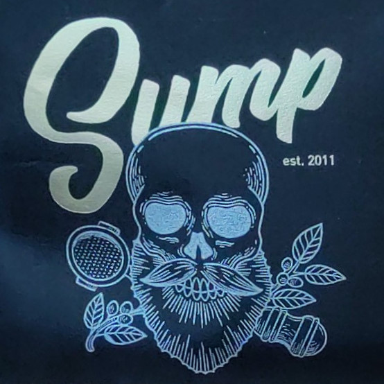 The Sump Coffee logo, a line drawing of a bald, bearded skull with a branch and portafilter crossed behind it.