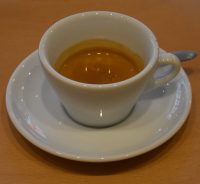 An espresso made with the Ocotepeque, a naturally-processed organic coffee from Honduras and served in a classic white cup at Screaming Beans on Asmsetlstraat.