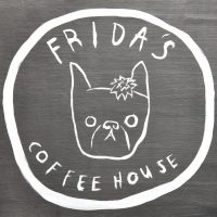The logo of Frida's Coffee House, a simplistic line drawing of a dog's head (Frida) in white on black, surrounded by the words "Frida's Coffee House" inside a white circle