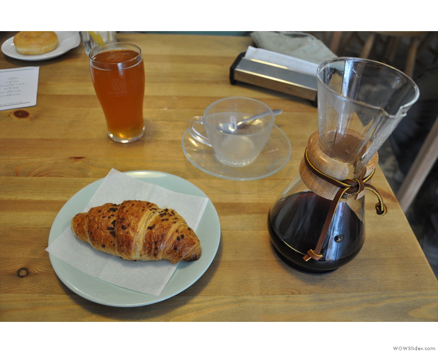 I paired my coffee with a chocolate croissant. The beer is not mine. Nor is the doughnut.