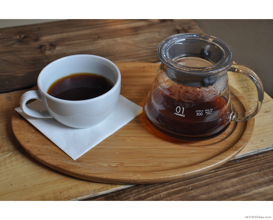 It was served properly, in a carafe, with a cup on the side, presented on a wooden tray.