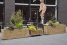 There's a large outdoor seating area on the pedestrianised street, fenced off by planters.