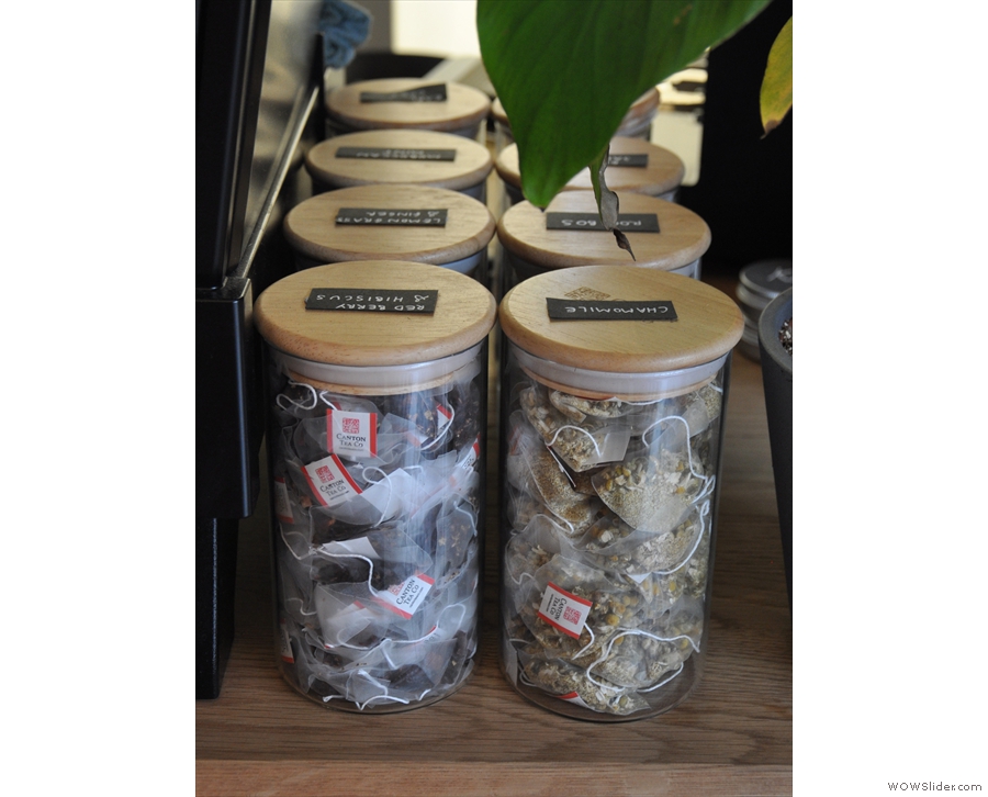 The tea bags, from Canton Tea, are kept in jars next to the espresso machine.