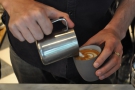 I love watching a latte artist at work.