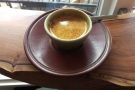 My espresso, in a lovely, earthenware, handleless cup.