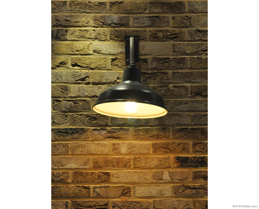 I love the combination of exposed brick and lighting.