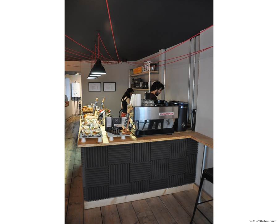The counter, like Frequency, is long and thin, with the espresso machine at the front...