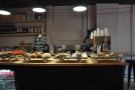 The coffee end of the operation is down at the front of the counter.
