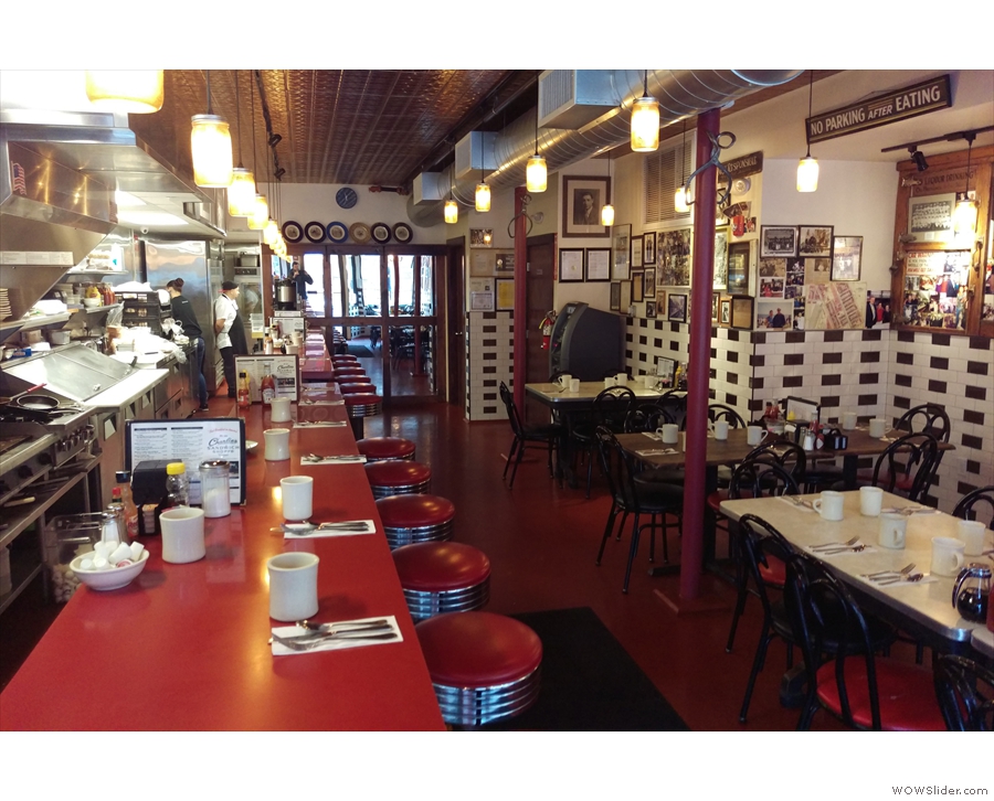 Charlie's is long and thin, with tables on the right-hand side.