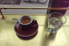 My espresso from my visit in 2016, complete with glass of water...