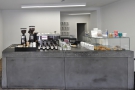 The front-on view: coffee to the left, till in the centre, cakes to the right.
