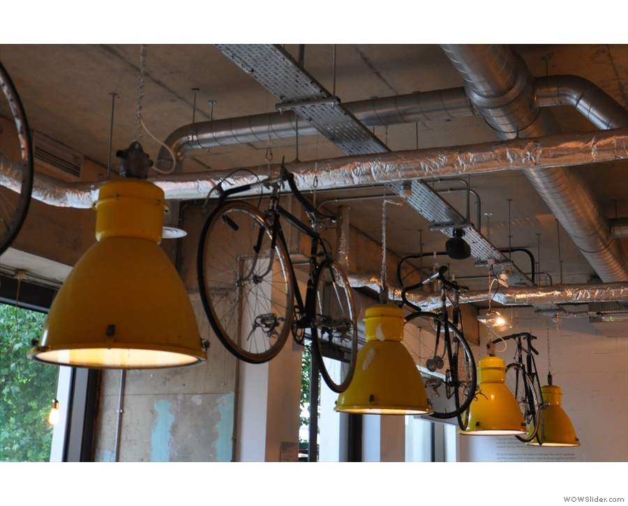 The Espresso Library has lots of light-fittings. These hang with the bicycles.