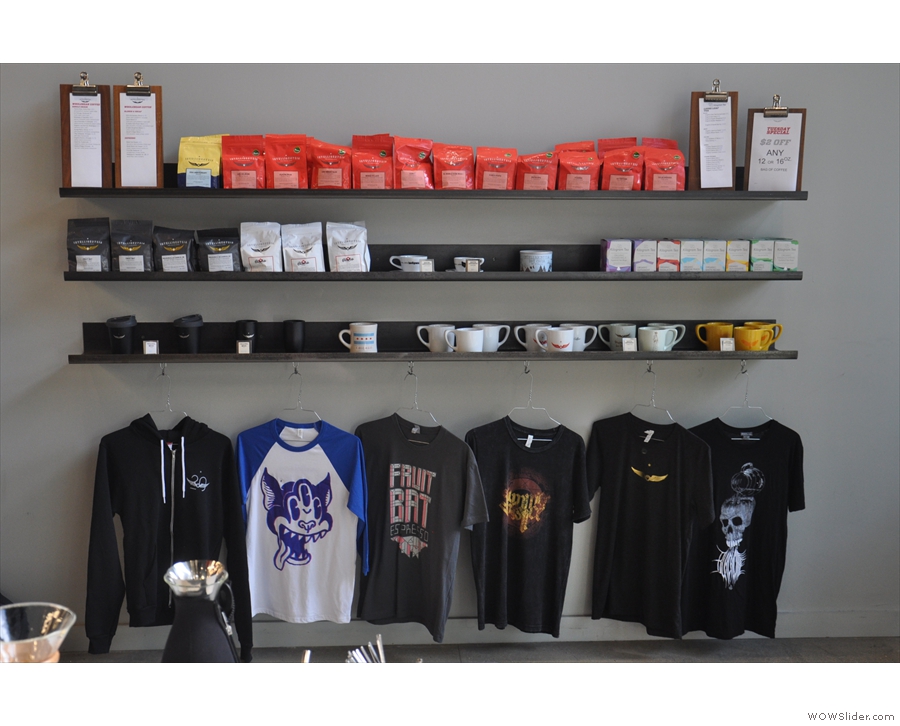 ... as well as t-shirts and branded cups on the shelves on the right-hand wall.