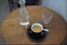 I order an espresso from local roasters Coutume which comes with a carafe of water. Nice touch.