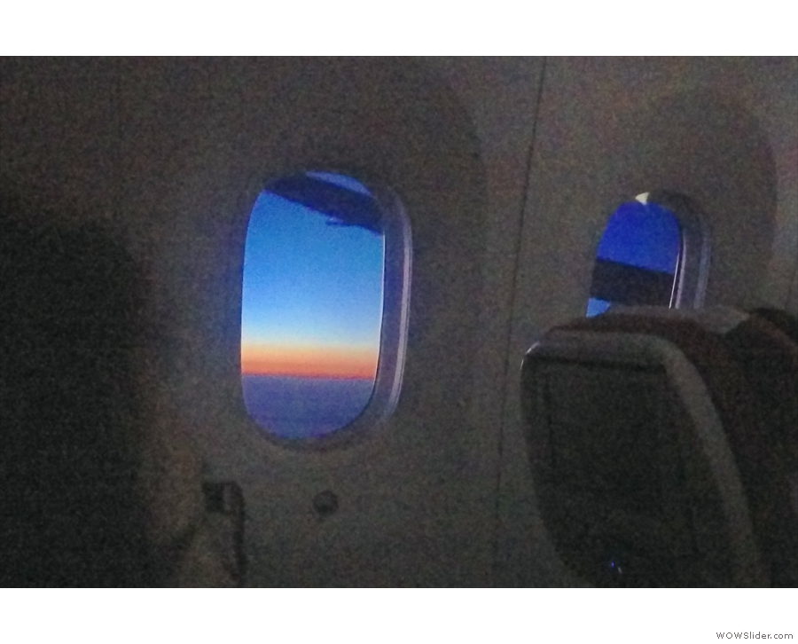 Somewhere over northern China or maybe Russia, there's a lovely sunset to the west...