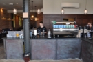 Down to business. The L-shaped counter has espresso machine and grinders facing front...