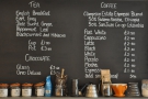 The menu is handily placed on the wall behind the counter. Here's the tea and coffee...