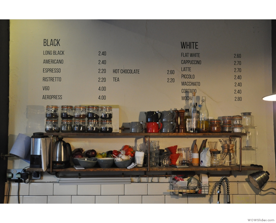 The menu is written on the wall behind the counter: black to the left, white to the right.