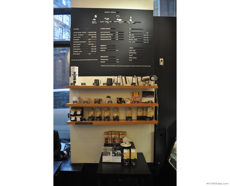 The menu is to the left, above the set of retail shelves.
