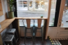 This mostly has stools, although if you sit in the windows, you get a nifty bar-chair.
