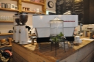 The espresso machine, a strikingly white La Marzocco, unusually on the corner of the counter.