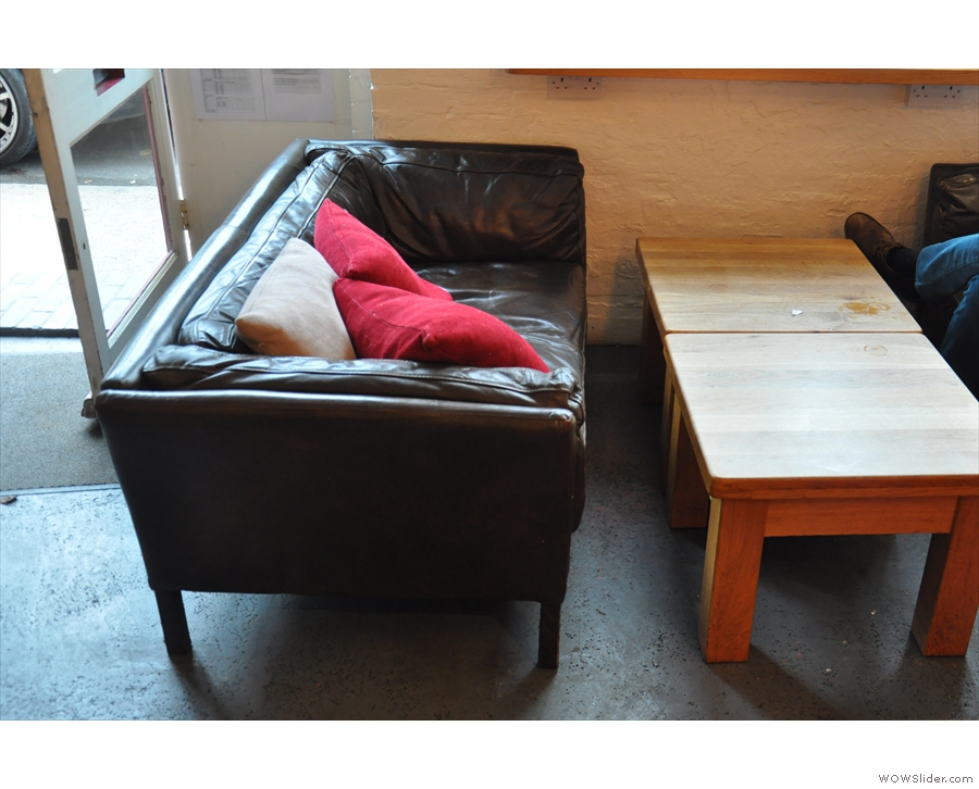 The communal table by the window's been replaced by two very comfortable-looking sofas...