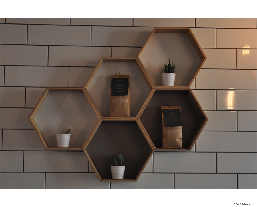 Cartwheel is full of neat things, inclduing these hexagonal storage units on the tiled wall.