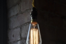 And finally, a single, bare bulb with a backdrop of exposed brick.