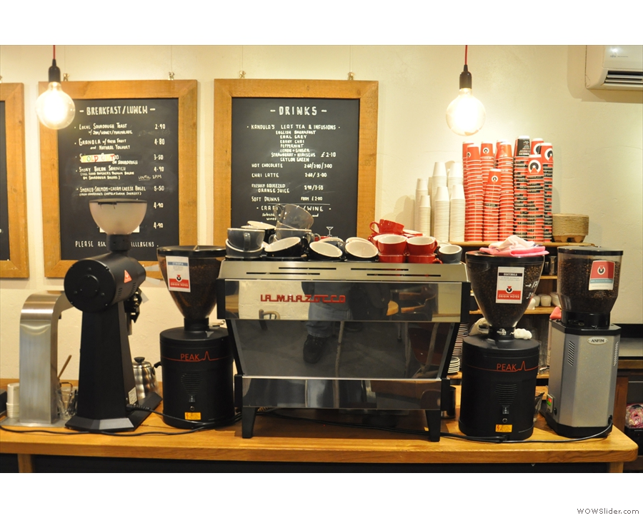 The espresso side of the business, with the La Marzocco flanked by its grinders.