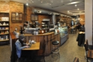 A panoramic view from just inside the door. The coffee end is at the front, beer at the back.