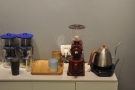 The pour-over gear is on the shelf at the back behind the counter...