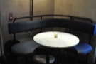 There's plenty of cafe-style seating here, incuding this round table to the left of the door.